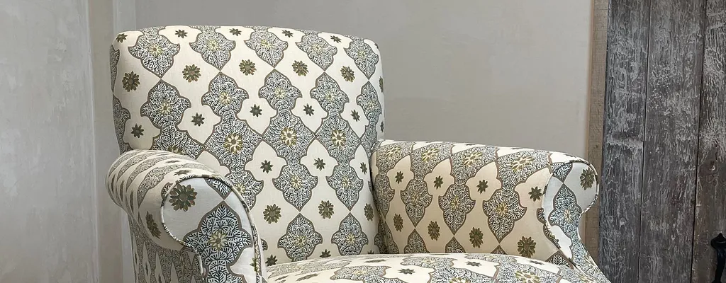 Armchair reupholstered in a patterned fabric